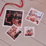 Retro Prints with Wooden Box - photo 2 Four photos laid out on a light wooden surface, with a red ribbon nearby. They show party scenes and pets.